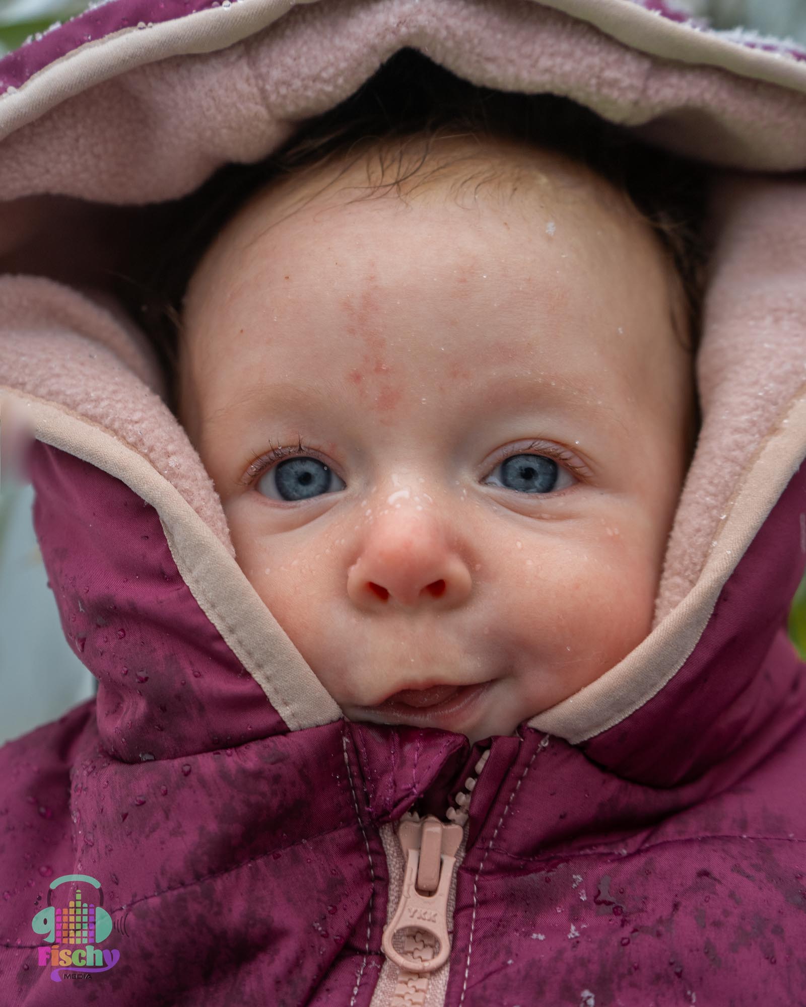 baby in a snowsuit
winter photoshoot
snow photoshoot
happy baby