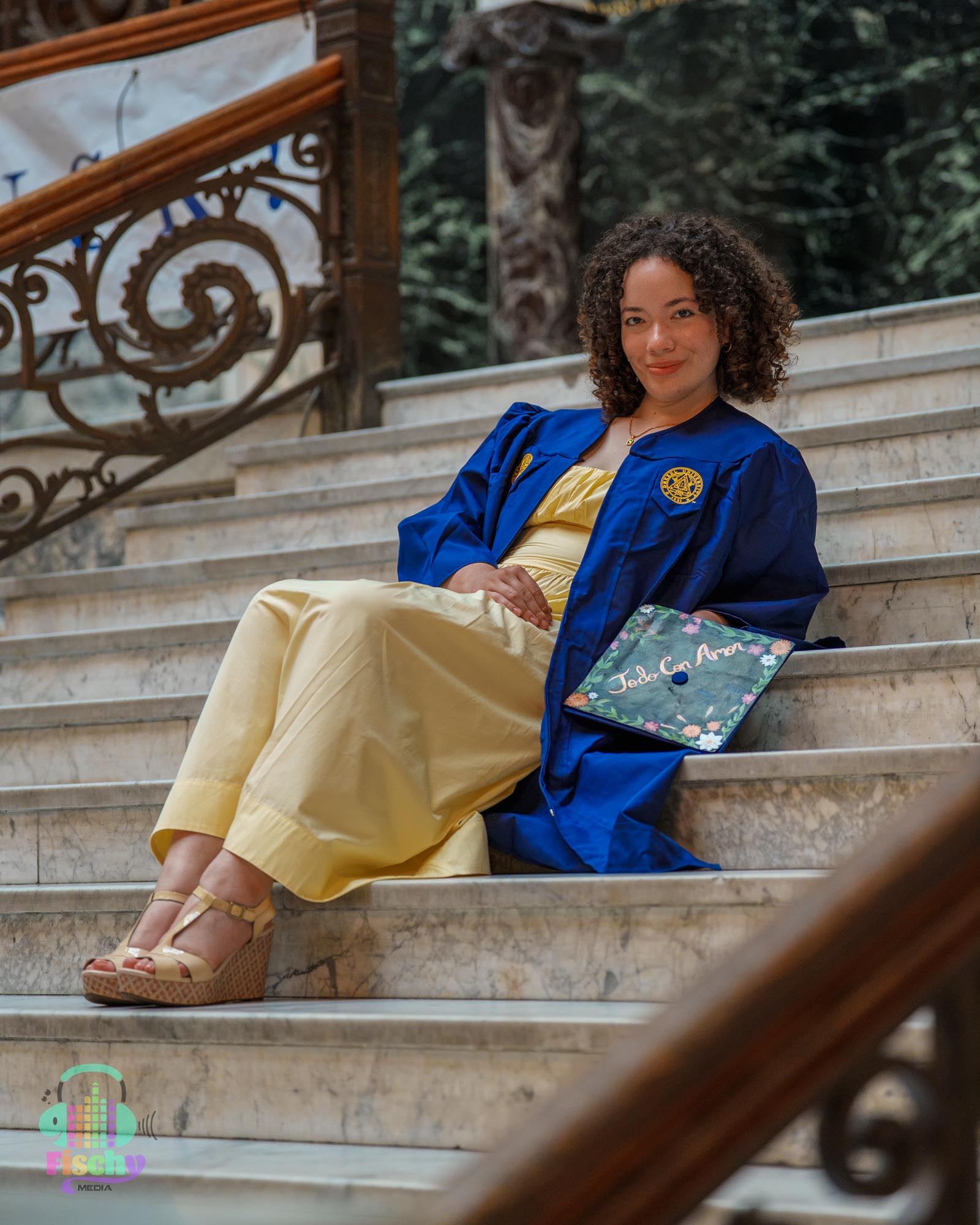 college graduate girl
graduate wearing cap and gown
graduate posing on steps
drexel
graduation photoshoot
grad pics