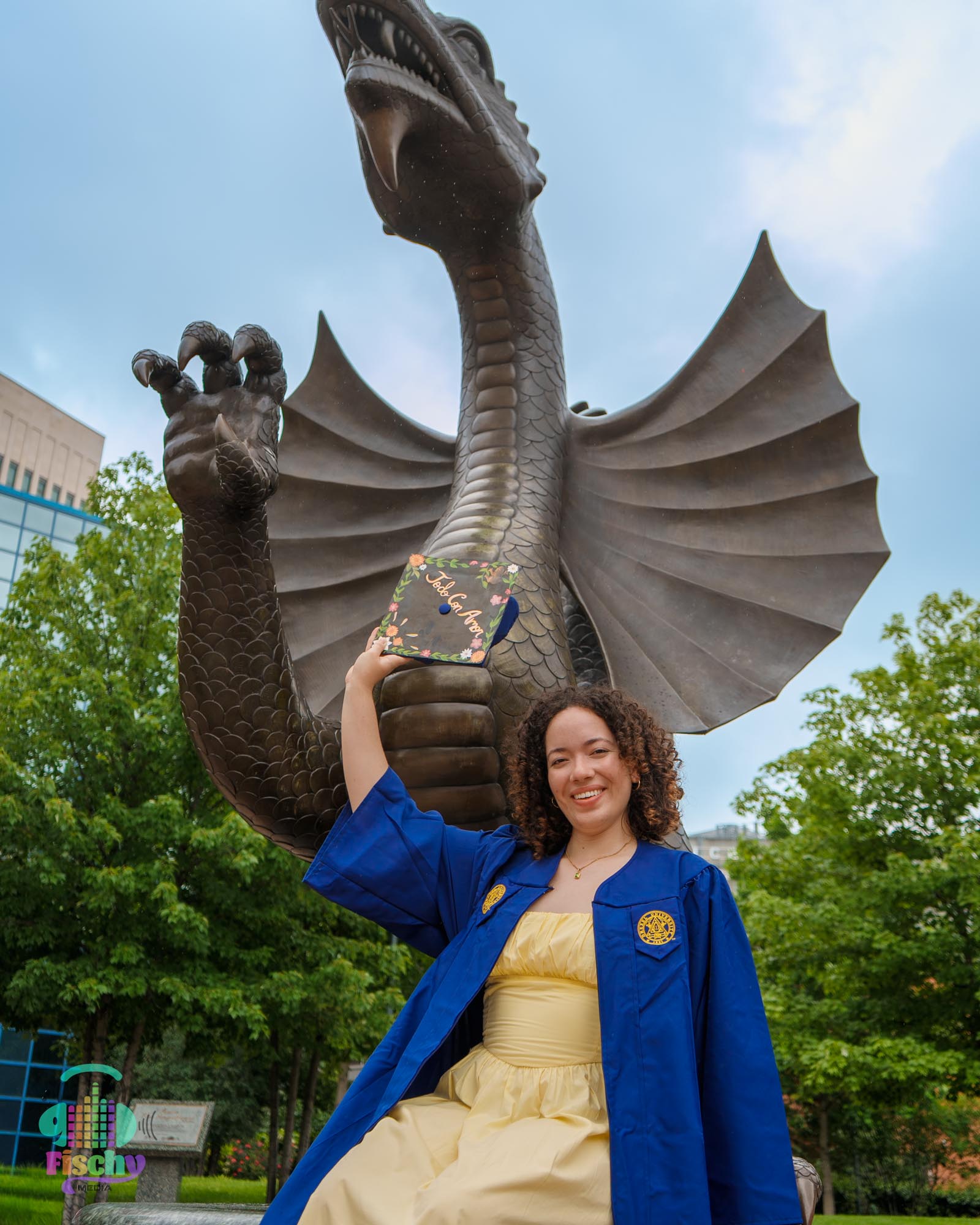 college graduate girl
graduate wearing cap and gown
drexel
graduation photoshoot
grad pics