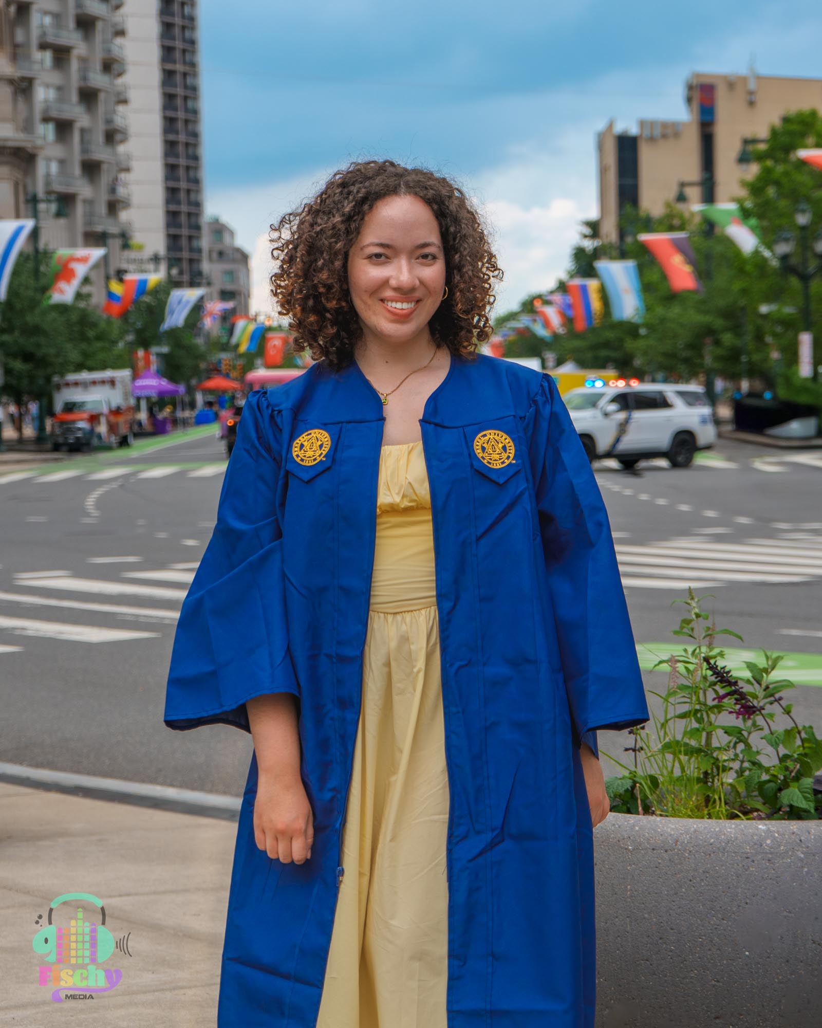 college graduate girl
graduate wearing cap and gown
drexel
graduation photoshoot
grad pics