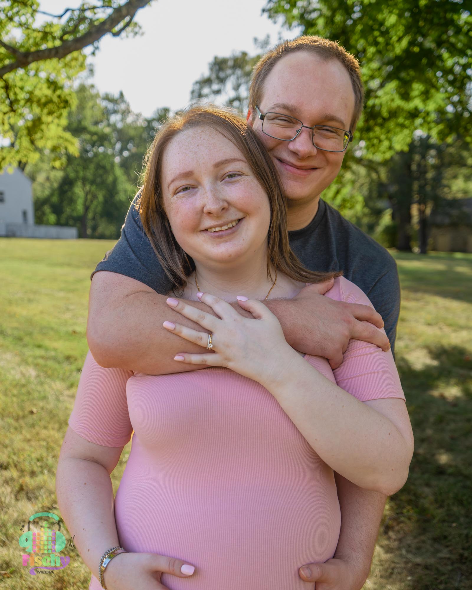 happy couple
pregnant woman in pink dress
maternity photoshoot
maternity photos
outdoor photography
outdoor maternity
couples' maternity photos
young couple
