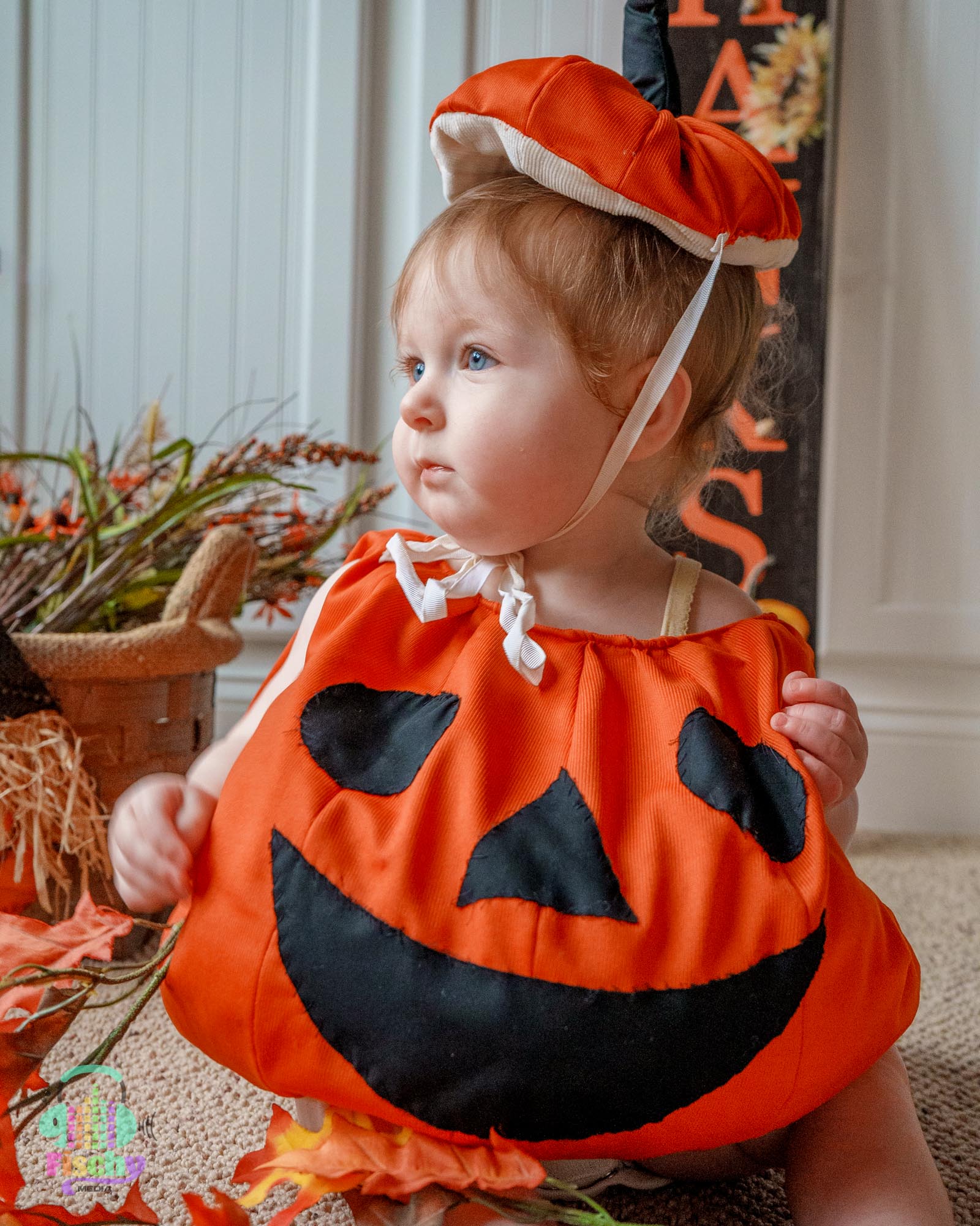 Baby girl in pumpkin outfit 
baby halloween photoshoot 
costume photoshoot
pumpkin photos