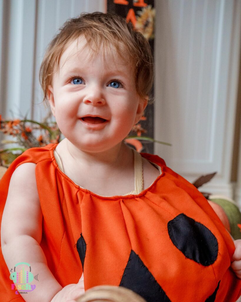 Baby girl in pumpkin outfit 
baby halloween photoshoot 
costume photoshoot
pumpkin photos