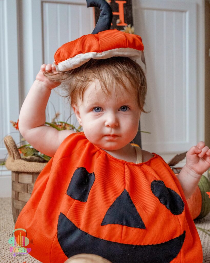 Baby girl in pumpkin outfit 
baby halloween photoshoot 
costume photoshoot
pumpkin photos