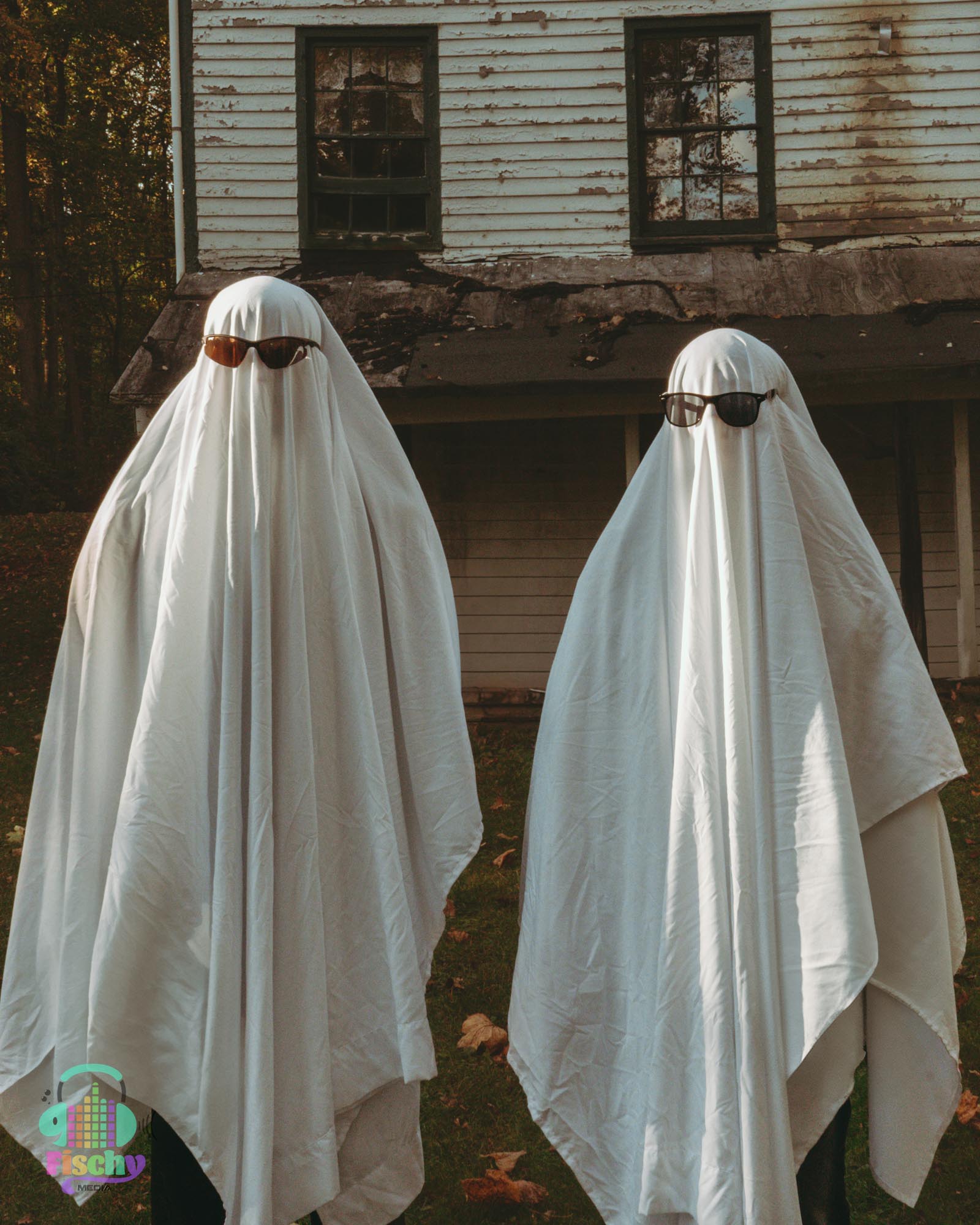 two people in fall clothing and ghost outfits
ghosts with sunglasses trend
abandoned building
halloween 
fall photos