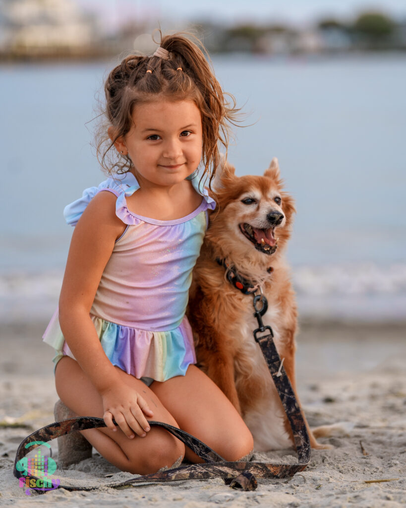 Kid and dog at the beach