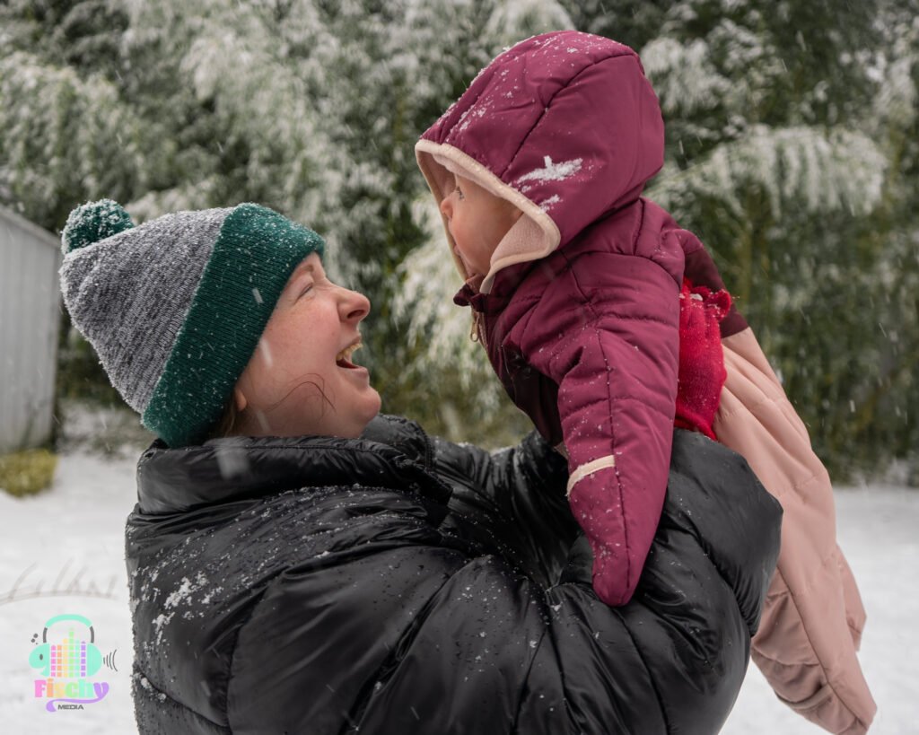 Mom and baby in snow