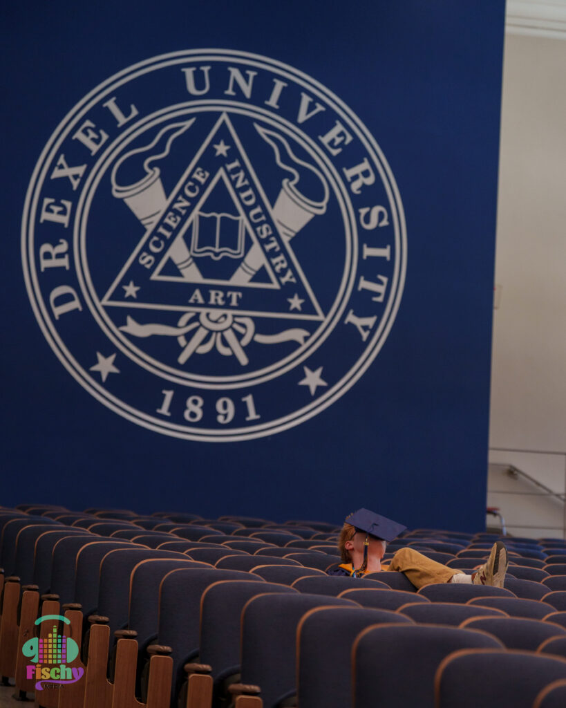 college graduate boy
graduate wearing cap and gown
drexel
graduation photoshoot
grad pics