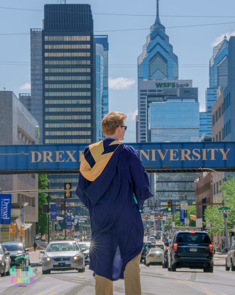 college graduate boy
graduate wearing cap and gown
drexel
graduation photoshoot
grad pics