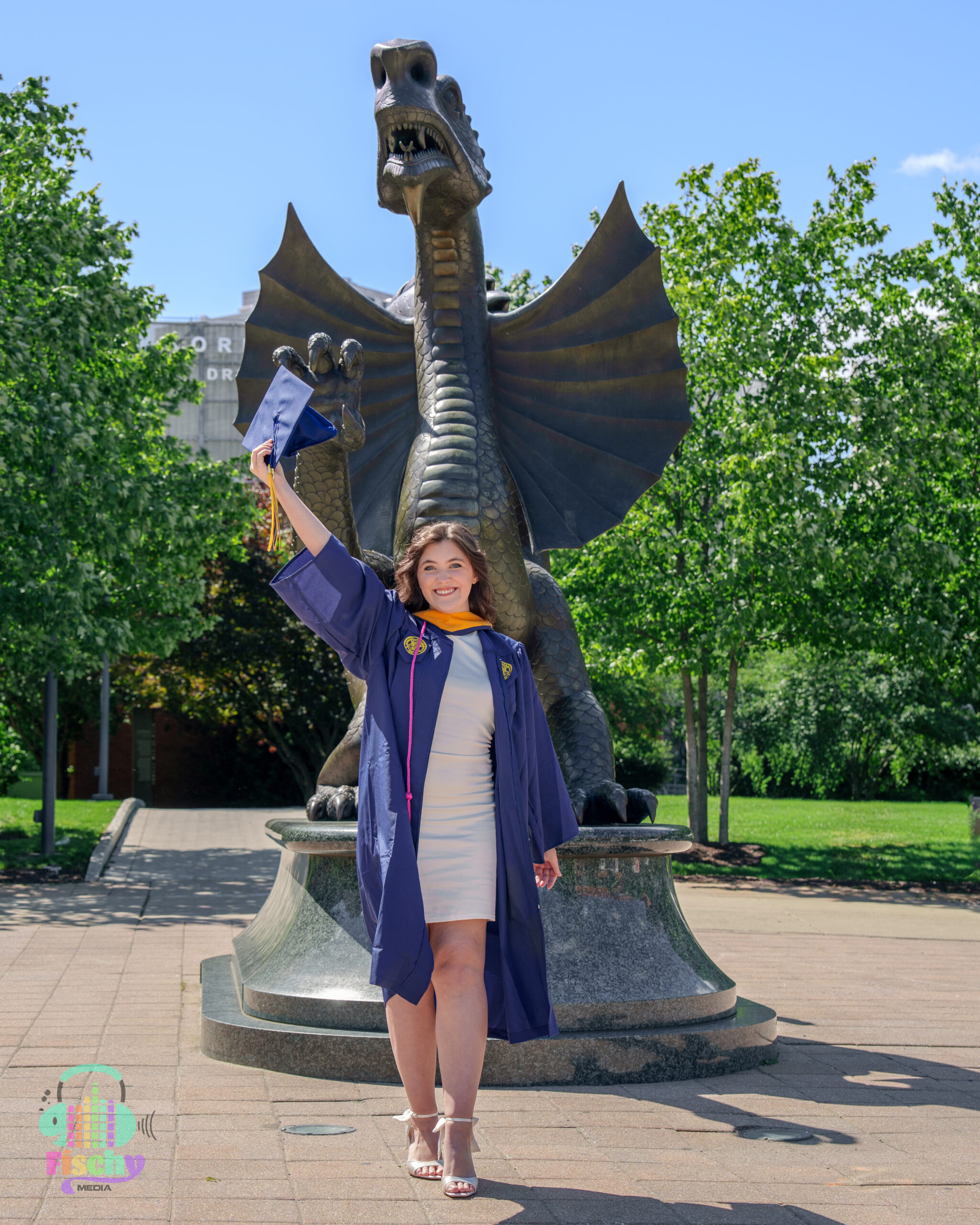 college graduate girl
graduate wearing cap and gown
drexel
graduation photoshoot
grad pics