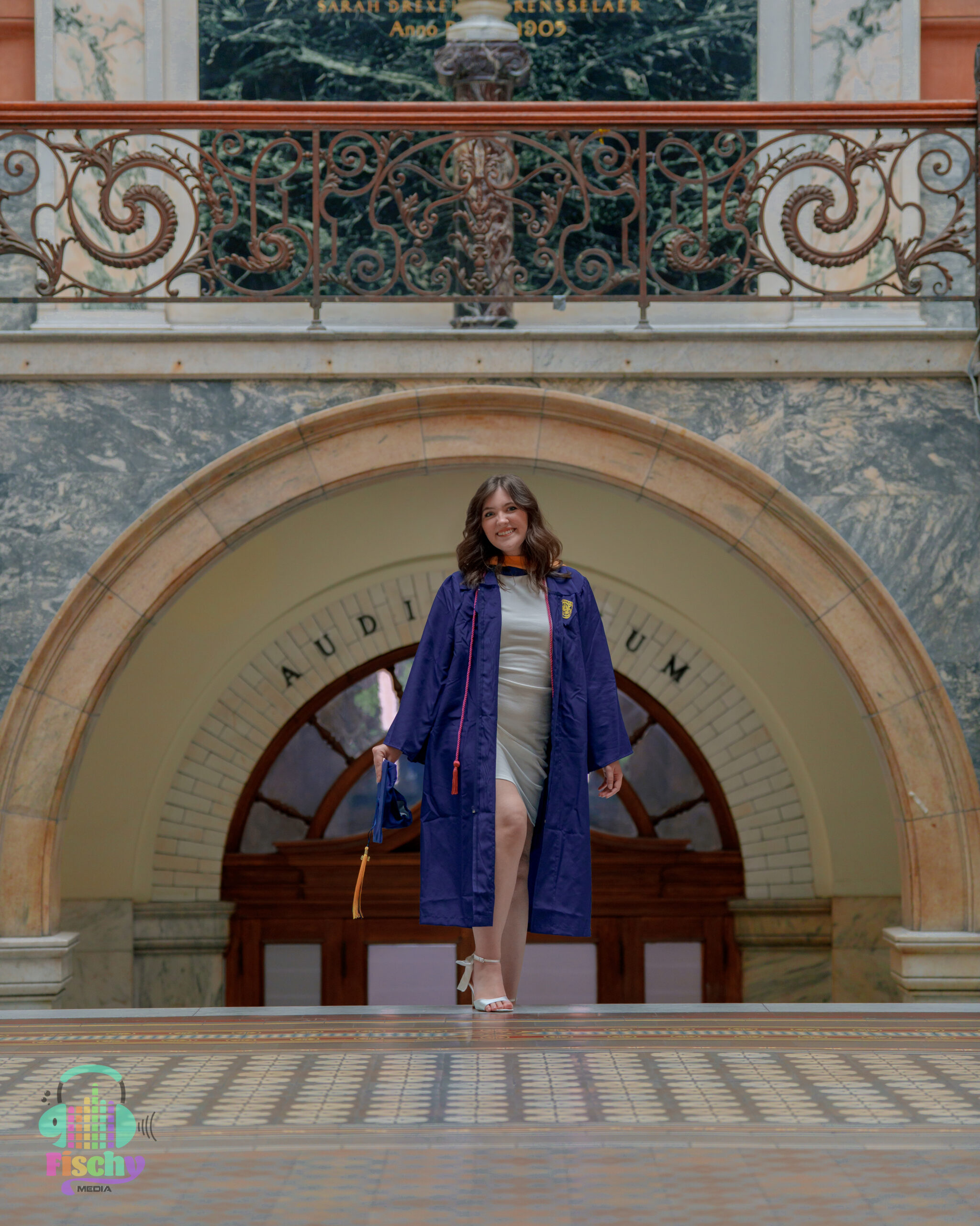 college graduate girl
graduate wearing cap and gown
drexel
graduation photoshoot
grad pics