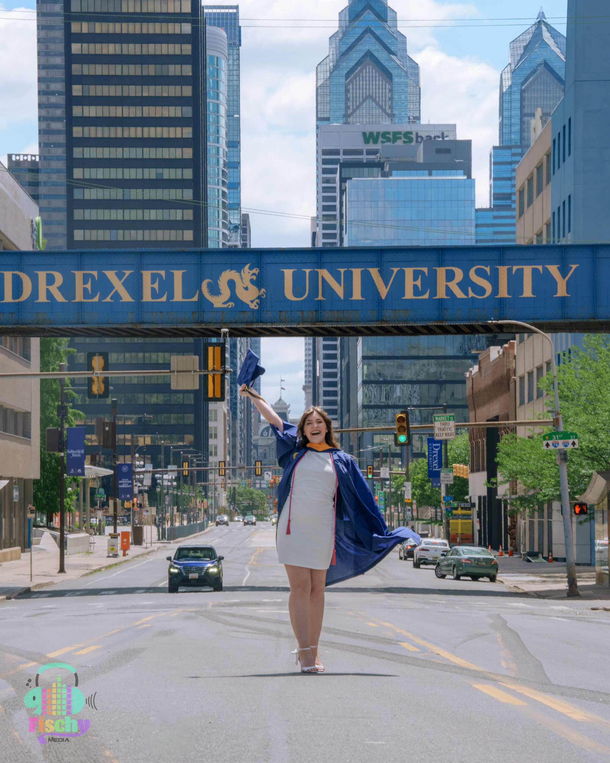 college graduate girl
graduate wearing cap and gown
drexel
graduation photoshoot
grad pics
